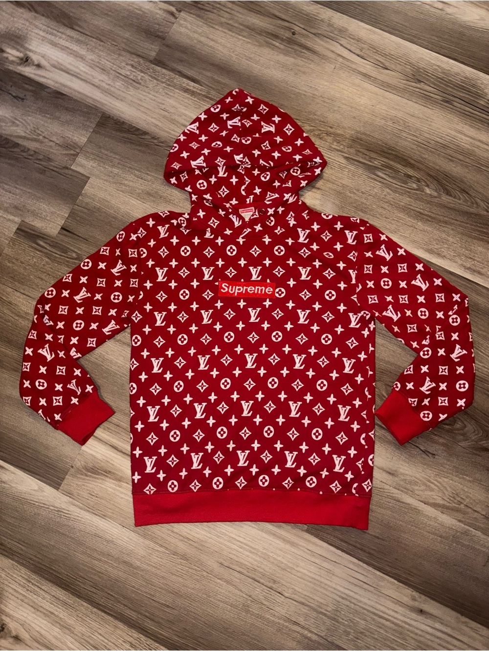 Supreme Red Hoodie with White Monogram Pattern